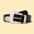 Close-up detail of women's black western leather belt with ornate silver bull head buckle. - 110x3.3cm / Black