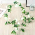 Artificial white rose flower vine for home wedding party ceiling and room decor hanging garland. - White