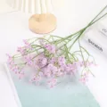 Detailed close-up of purple artificial baby's breath flowers, perfect for home decor and floral art. - Purple