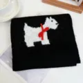 Detailed view of black knit scarf with white cute animal and red bow decoration. - Mischievous Dog / Black