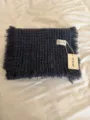 Dark grey knitted fringed winter scarf detail shot, warm and cozy solid color neck wrap. - Dark Gray