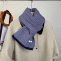 Detailed view of the retro color-block striped knitted scarf, warm and cozy winter neckwear. - Purple and Gray Striped