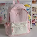 Pink cute school backpack detail featuring sweet bow embroidery in a cozy room aesthetic. - Single Bag / Pink