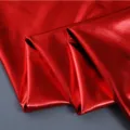 Red metallic shiny fabric material close up texture for creative costume sewing and crafts - Red