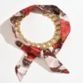 Close-up detail of the fashion chain silk scarf necklace, featuring red patterned fabric. - Red White Pink Colorblock Style (X2264A)