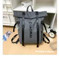 Detail view of grey roll-top travel backpack with straps, large capacity casual daily bag. - Dark Gray