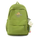 Green canvas school backpack for women, casual daily travel daypack with cute cartoon print. - Green
