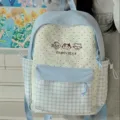 Detail view of cute Japanese style student backpack with polka dot and gingham pattern design. - Blue