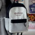 Cute Japanese style plaid school backpack detail view showing pockets and embroidery. - Black