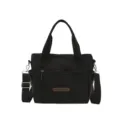 Minimalist black nylon shoulder bag for women, casual tote with zipper pocket and strap. - Black