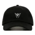 Close-up detail of the black washed cotton baseball cap featuring unique white hand gesture embroidery. - Adjustable / Black