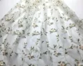 Embroidered mesh fabric detail, sheer tulle with vine and floral pattern, elegant lace material. - One Size / Milky White