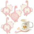 Detail view of cute cartoon pony silicone cup coasters with hanging hook and ceramic mug prop. - 5