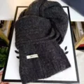 Dark grey wool blend knit scarf detail, soft cable knit winter neck warmer with cozy texture. - Black