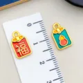 Ciondolo in metallo smaltato dorato zucca Fu Lu accessori per gioielli fai da te collane - Perla Zucca Fu Doppia Faccia (22536) / 1 Pezzo (14x8mm) / rosso e verde