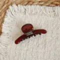 Close-up detail of a dark brown acetate hair claw clip featuring elegant handmade lettering. - 6cm / Translucent Coffee