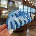 Close-up detail view of the blue marbled hair claw clip, featuring elegant resin texture. - Ocean Blue
