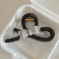Elegant brown hair claw featuring an iridescent bow design, stylish and large shark clip for women. - Extra Large 13cm / AB Color