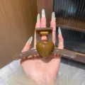 Brown heart hair claw clip detail view showing elegant acrylic design and strong spring for thick hair. - Oversized / Brown Heart