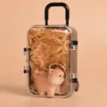 Wood carving Shiba Inu keychain detail showing cute animal pendant inside clear mini suitcase box. - Shiba Inu Wood Carving Pendant with Luggage Box