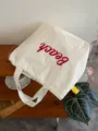 Casual canvas tote bag with red letter print, stylish shoulder bag for daily commuting student. - Double-Layer Thickened / White