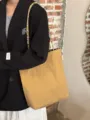 Detail view of the stylish canvas shoulder tote bag with unique beaded straps and chic design. - Khaki