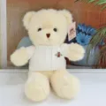 Beige teddy bear plush toy wearing a white knit sweater with a cute bee brooch detail. - Bee White Sweater Beige Bear / 30 cm