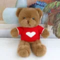 Detailed close-up of a cute plush teddy bear featuring soft brown fur and a red heart sweater. - Red Heart Sweater Brown Bear / 30 cm