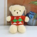 Adorable beige teddy bear plush toy wearing a cozy red and green knitted sweater for kids. - Red Sweater Beige Bear / 30 cm