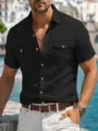 Detail view of men's short sleeve linen work shirt featuring double chest pockets. - S / Tops / Black