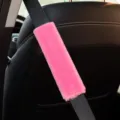 Pink plush car seatbelt cover, soft faux rabbit fur shoulder pad for auto interior comfort. - Pink