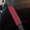Red leather car seat belt shoulder pad with embossed diamond pattern for driving comfort. - 6.5x23cm / Burgundy