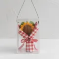 Handcrafted crochet sunflower bouquet in a clear gift box with red checkered wrapping. - Scholar Success Sunflower / Red