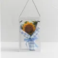Handmade crochet sunflower bouquet in clear gift box with blue checkered wrapping paper. - Smiley Sunflower / Light Blue White