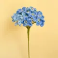 Handcrafted crochet forget-me-not flower stem, blue yarn floral decor gift variant. - Gradient Blue