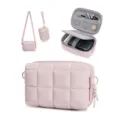 Detailed view of the pink quilted camera storage bag, interior mesh pockets and straps. - Pink