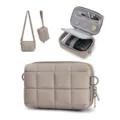 Padded quilted camera bag interior organization details with multiple mesh pockets and adjustable straps. - Camel