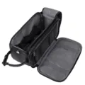 Detailed view of the black travel toiletry bag interior compartments and mesh pockets. - Black