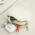 Portable white quilted zipper coin purse storage bag for daily essentials and earphones. - White