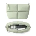 Light green quilted cosmetic bag with large capacity, dual zipper, and neat interior storage. - Light Green