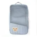 Portable travel storage bag with mesh window and cute bear patch for luggage organization. - Blue