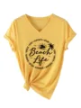 Women casual V-neck short sleeve yellow t-shirt with beach life graphic and knotted hem. - S / Yellow