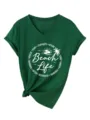 Green V-neck short sleeve women's t-shirt with beach life graphic and knot hem detail. - S / Vintage Green