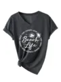 Grey V-neck short sleeve T-shirt detail showing beach life graphic and knotted hem. - S / Black Heather Grey