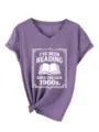 Casual women's purple V-neck short sleeve T-shirt with book reading graphic print detail. - 3812-Purple (White Text)