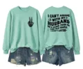 Detailed front and back view of mint green sweatshirt with funny text and skeleton hand. - Light Green (Black Pattern)