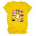 Trendy yellow short-sleeve t-shirt for women featuring cute pink Halloween ghost and bow print graphic. - S / Tops / Yellow