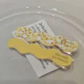 Detail view of two retro acetate wavy hair clips in solid yellow and patterned designs. - Yellow-6cm