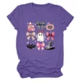 Close up detail of the cute Halloween pink bow and ghost graphic printed on purple t-shirt. - S / Tops / Purple