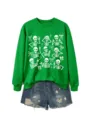 Green long sleeve skeleton print sweatshirt paired with stylish denim shorts for women. - S / Tops / Grass Green